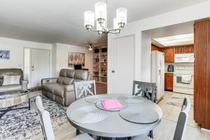 a living room with a table and a couch at 1 Mi to Whiskey Row and Town Sq Remote Work Hub! in Prescott