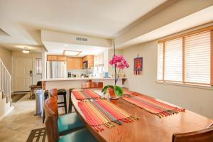 a dining room table with a vase of flowers on it at South Bluff Beauty Ocean Views Galore 2 Bedroom in La Selva Beach