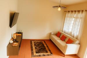 TV a/nebo společenská místnost v ubytování Chalé Roberta