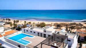an aerial view of a resort with a beach at Sal & Mar in Santa Maria