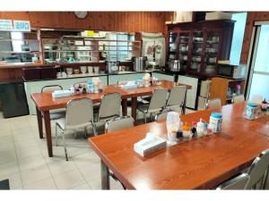 a restaurant with tables and chairs in a kitchen at Hotel Pacific - Vacation STAY 07296v in Ishinomaki
