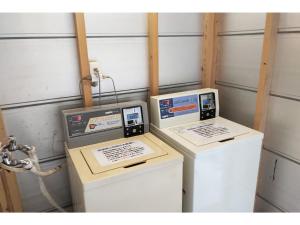 two machines sitting next to each other in a room at Hotel Pacific - Vacation STAY 07296v in Ishinomaki +4 photos