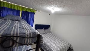 Postel nebo postele na pokoji v ubytování Alojamiento Ideal en Paipa