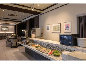 a buffet line with food on it in a restaurant at K,M,H Art hotel by Kure Morisawa - Vacation STAY 23290v in Kure