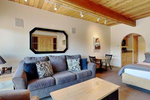 a living room with a couch and a bed at Timberline Condominiums Studio Deluxe Unit 217 in Snowmass Village +17 photos