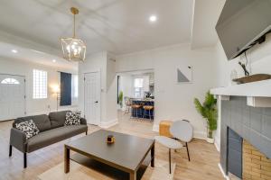 a living room with a couch and a table at 4 Mi to Dtwn Pet-Friendly Home in Pittsburgh in Beltzhoover