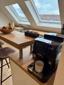 a kitchen with a coffee maker on a counter at Lupi Blue - stylish und cosy Apartment in Buchen