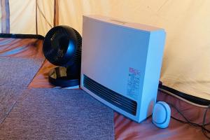 a computer monitor and a fan sitting on a floor at TOCORO. Mt.Fuji CAMP & GLAMPING - Vacation STAY 23398v in Oishi +16 photos