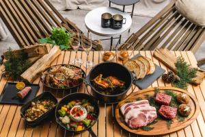 a table with different types of food on it at TOCORO. Mt.Fuji CAMP & GLAMPING - Vacation STAY 23388v in Oishi