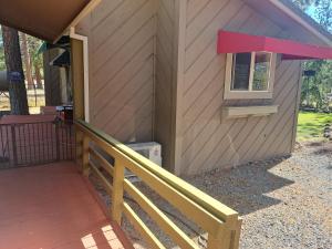 a house with a porch and a window on it at The Lake House in Weed