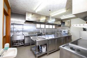 a large stainless steel kitchen with stainless steel appliances at Kanon suisha - Vacation STAY 25508v in Kawaba