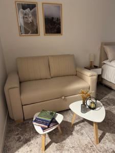 a living room with a couch and a table at Modern apartment with a beautiful panoramic view in Bogotá +1 photo