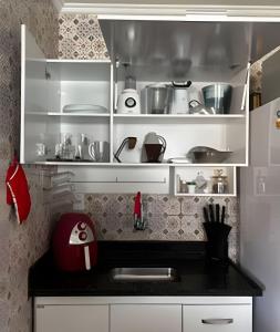 Kuchyň nebo kuchyňský kout v ubytování Apartamento Central Confortavel com WiFi Rapido e Lava Seca + 10 fotografií