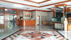 a living room with a large tile floor and a lobby at Poonchock Mansion in Bangkok