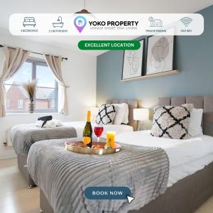 two beds in a room with a tray with wine bottles and glasses at Grange House with Free Parking, Garden, Superfast Wifi and Smart TVs with Netflix by Yoko Property in Northampton