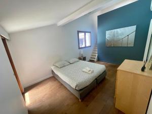 a bedroom with a bed and a blue wall at Exceptional villa, private pool, near Bordeaux in Cestas +60 photos
