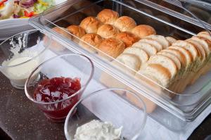 a plastic container filled with bread and other food items at The Empress Hotel in Daejeon