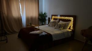 Una cama o camas en una habitación de Charming City Retreat in Agdal- Walk to Arribat Center & Train