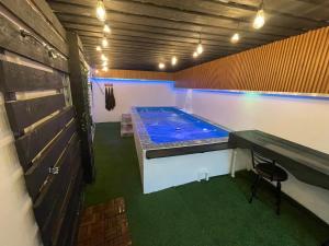 a hot tub in the middle of a room at Casa Pulu Oasis, Private Pool, Office & Parking in Moca