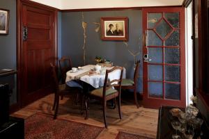 a dining room with a table and chairs at Barbour House in Gunning