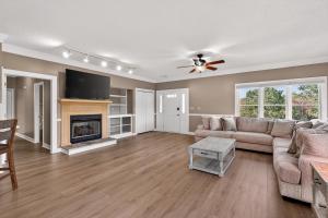 a living room with a couch and a fireplace at Whitepath Lodge and Resort in Ellijay