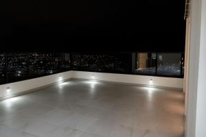 an empty room with a view of a city at Flats Tavares Araujo apt 102 in Garanhuns