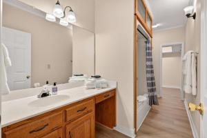 a bathroom with a sink and a large mirror at The Ellijay Resort in Ellijay +125 photos