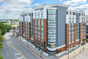 a rendering of the courtland hotel on a city street at Courtyard by Marriott Athens Downtown in Athens
