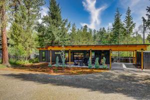 a modern house with a yellow facade at Two Pines - Unique container home w/hot tub - Downtown - Trailer Parking - Pet friendly in McCall