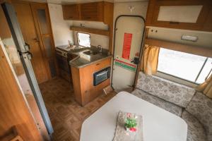 an interior view of a kitchen in an rv at Camping Tiradentes in Tiradentes
