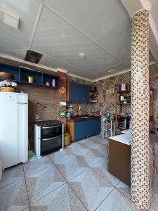 Η κουζίνα ή μικρή κουζίνα στο Aconchego de luxo para COP 30