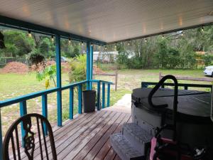 a screened in porch with two chairs and a mattress at Your second home in florida in Altoona