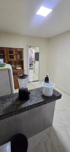 a kitchen with a counter with a bowl on it at Linda Casa 3 suítes in Belém