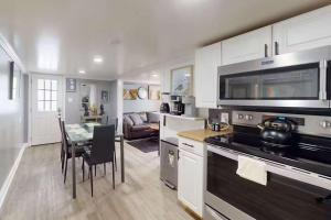 a kitchen with a table and a dining room at Parrot Bay 35 in Ocean City