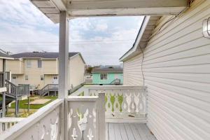 a porch with a white fence and a balcony at Parrot Bay 35 in Ocean City +22 photos