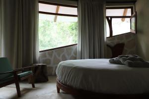 Ένα ή περισσότερα κρεβάτια σε δωμάτιο στο Casa Caracol