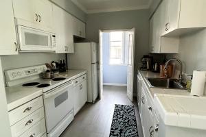 a kitchen with white appliances and a white refrigerator at Big one bedroom in the Palo Alto, close to Stanford, CA USA -Newly remodeled, Nice Relaxing Place in Palo Alto +5 photos