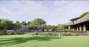 eine Außenansicht eines Gebäudes mit Rasen in der Unterkunft Amorita Resort Palawan in Puerto Princesa