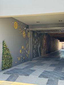 a hallway with a mural on the wall at Isi house in Morteros