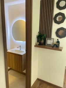 a bathroom with a sink and a mirror at Casa en Ambato in Ambato