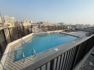 a large swimming pool on top of a balcony at Comodo y hermoso departamento en centro histórico in Santiago