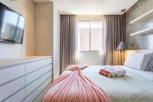 En eller flere senge i et værelse på Apt Premium Work & Stay dentro do shopping + 16 billeder