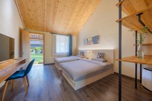 a bedroom with a bed and a wooden ceiling at Floral Moganshan Natural Residence Pet Resort B&B in Huzhou