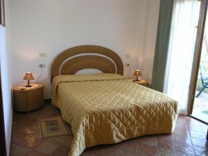 Postel nebo postele na pokoji v ubytování Agriturismo Podere San Michele