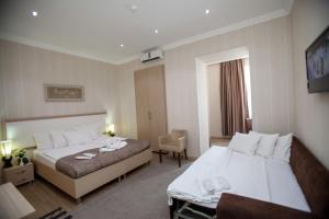 Letto o letti in una camera di Rustaveli Palace