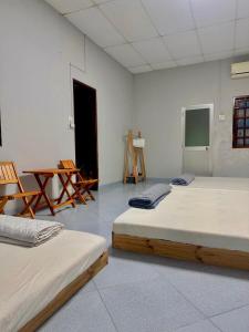 Giường trong phòng chung tại Home Sun Moon - Phan Thiết