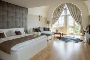 Postel nebo postele na pokoji v ubytování Villa Grande - Apartmány