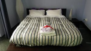 A bed or beds in a room at Il Riposo del Guerriero Guesthouse