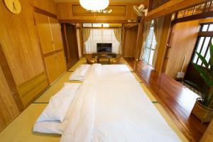 En eller flere senge i et værelse på Resort Villa N&N