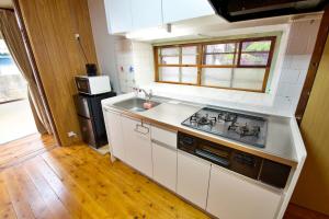 Køkken eller tekøkken på Resort Villa N&N + 37 billeder